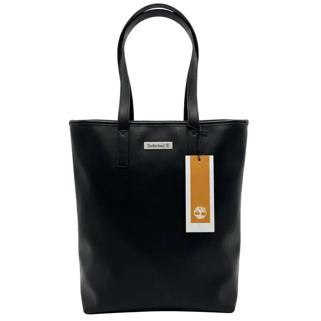 Borsa Timberland Tote nera da donna, modello shopper verticale. Design minimale in ecopelle con logo argentato e cartellino iconico Timberland. Ideale per il lavoro o il tempo libero.