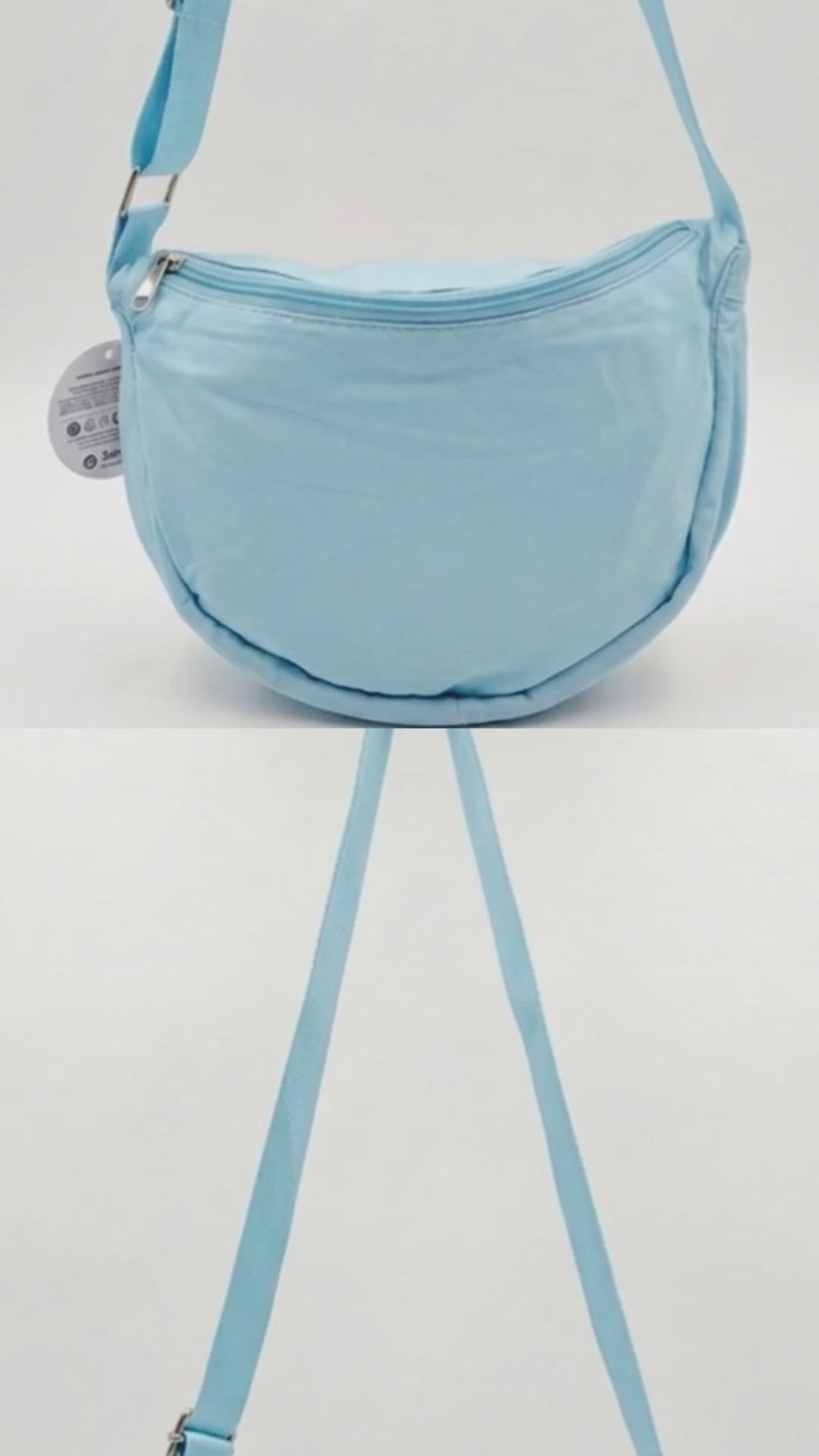 Borsa a spalla azzurro pastello (modello dumpling bag) con zip argento. Video di presentazione prodotto che mostra la forma ergonomica e i dettagli del materiale sintetico leggero.